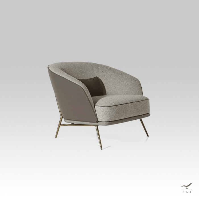 Charlie armchair with leather exterior and fabric interior on slim legs