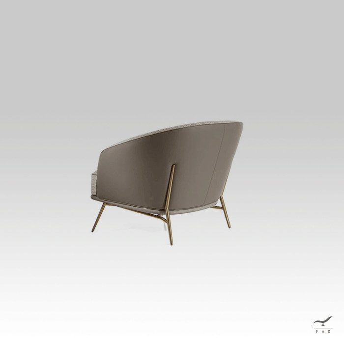 Charlie armchair with leather exterior and fabric interior on slim legs