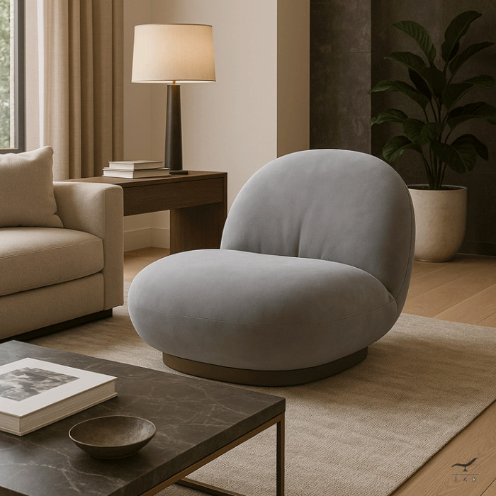 The Milo chair redefines relaxation through a blend of fluid lines, low-profile proportions, and sumptuous materials.